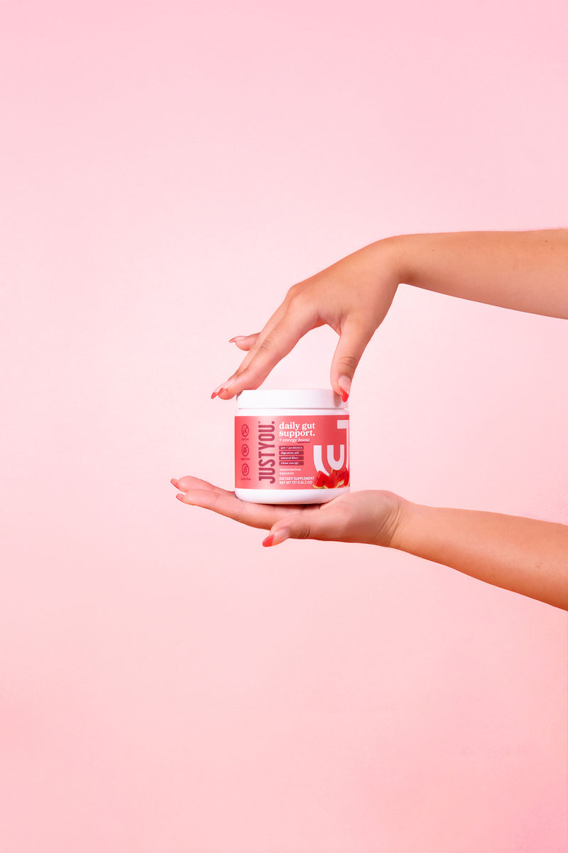 Daily gut support jar in hands